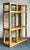 Infuse your home with relaxed elegance with this vintage Coastal wrapped rattan etagere. This stunning piece beautifully...