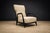 Executed in pau marfim (ivory wood) with an ebony finish, this armchair exemplifies the sculptural refinement...