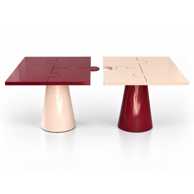 A puzzle-top table by Alexandre Ligios in crossed bordeaux-and-taupe lacquer — splits apart into two independent side...