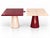 A puzzle-top table by Alexandre Ligios in crossed bordeaux-and-taupe lacquer — splits apart into two independent side...