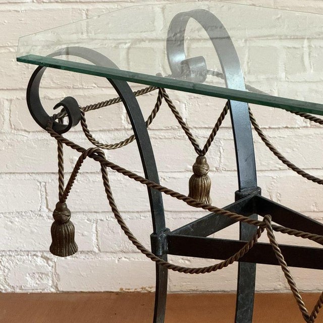 1960s style metal framed console table with gilt rope and tassel detailing. Measurements H: 65cm L: 115cm W: 45cm...