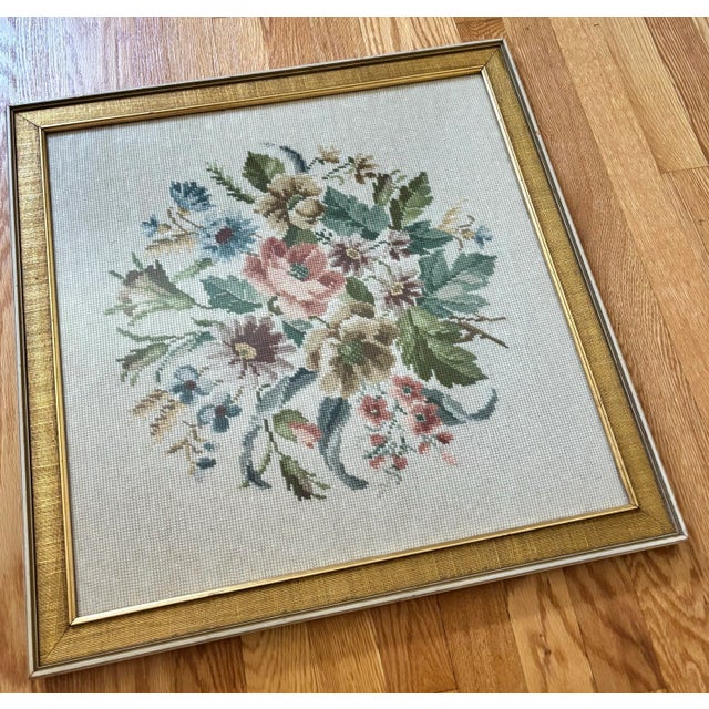 Beautiful framed floral needlepoint in a textural gold frame. Appealing colors and design. Was framed in New England in...