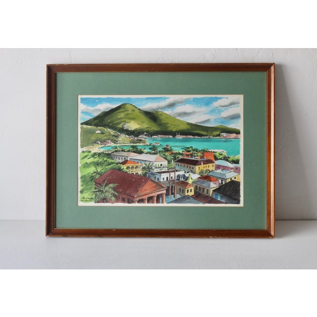 Watercolor on paper showing the harbor and town of Charlotte Amalie by regional artist Ira Smith. The famous port on St....