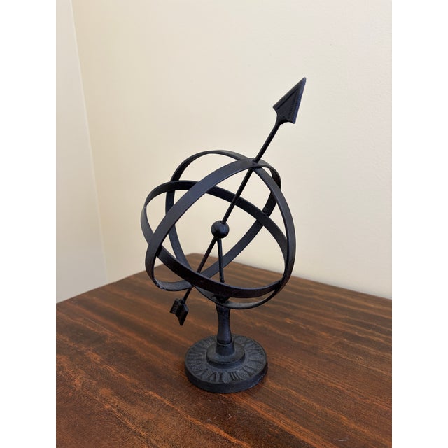 A beautifully crafted iron armillary sphere, evoking the timeless elegance of classical European gardens. Pieces like this...
