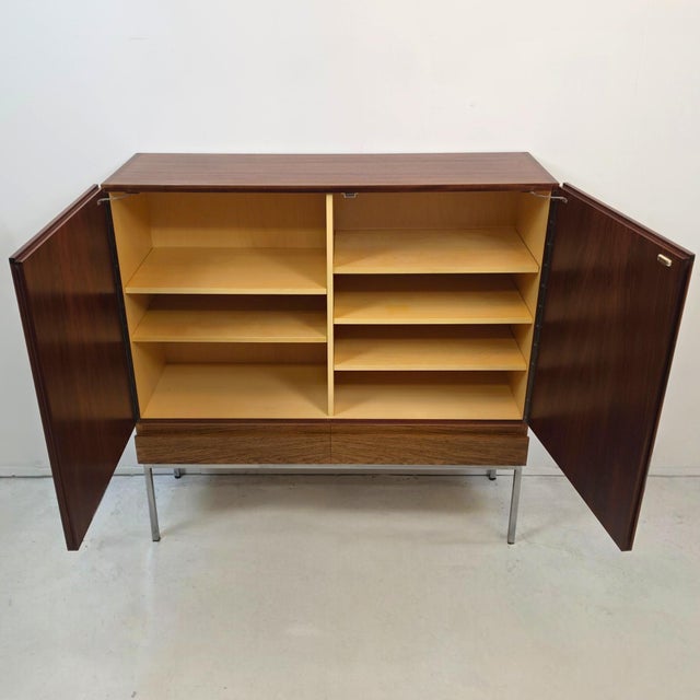 Mid-Century B60 Highboard in Rosewood and Chrome by Dieter Waeckerlin for Behr, 1970s, in Very Good conditions. Designed...