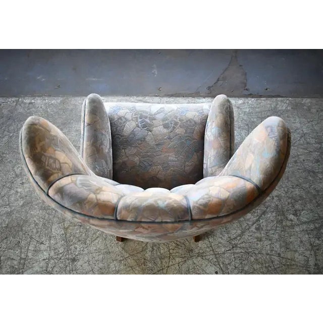 Super charming 1950s semi tall channel back lounge chair by Peter Hvidt and Orla Molgaard. Very sculptural organic shape...