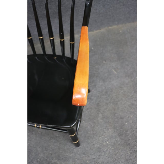A commemorative Windsor-style armchair created for Wake Forest University, featuring a black painted finish with...