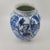 This Striking Blue and White Porcelain Chinoiserie Bud Vase features a timeless Chinoiserie aesthetic. The body is...