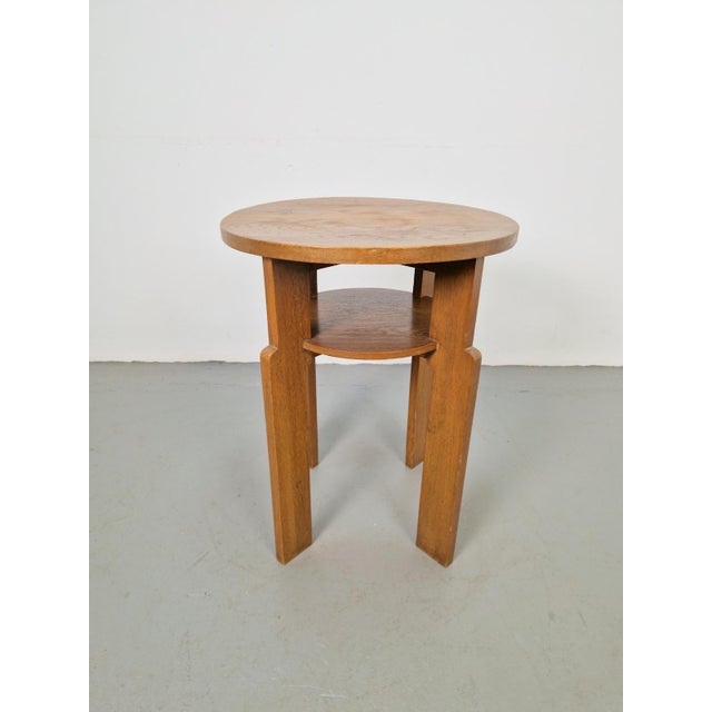 This beautiful vintage Art Deco side table from the 1930s features beautiful lines with many round shapes. The side table...