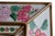 An exceptional mid-century cushion mirror attributed to Italy, featuring individually fitted reverse-painted glass panels...