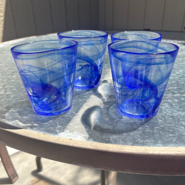 The Bormioli Rocco "Murano" blue swirl low ball glasses -set of 4 were primarily produced in Italy during the 1980s and...