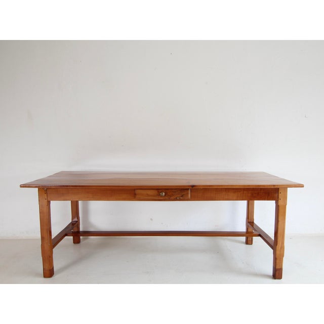 Solid cherry wood dining table from the 2nd half of the 19th century, with later additions. Traditional, minimalist design...