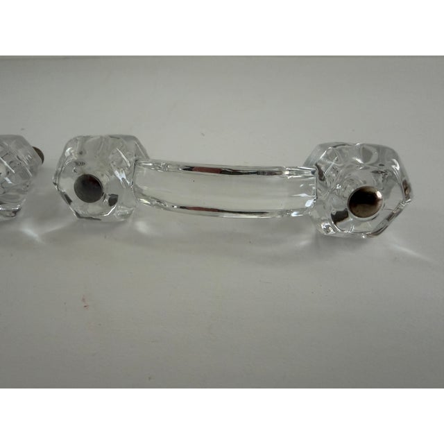 Description: This listing is for a pair of vintage clear glass bridge-style drawer pulls with faceted ends and original...