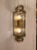 The Cadence Large Tiered Sconce was designed by Carrier and Company for Visual Comfort & Co. Its 21-inch silhouette...