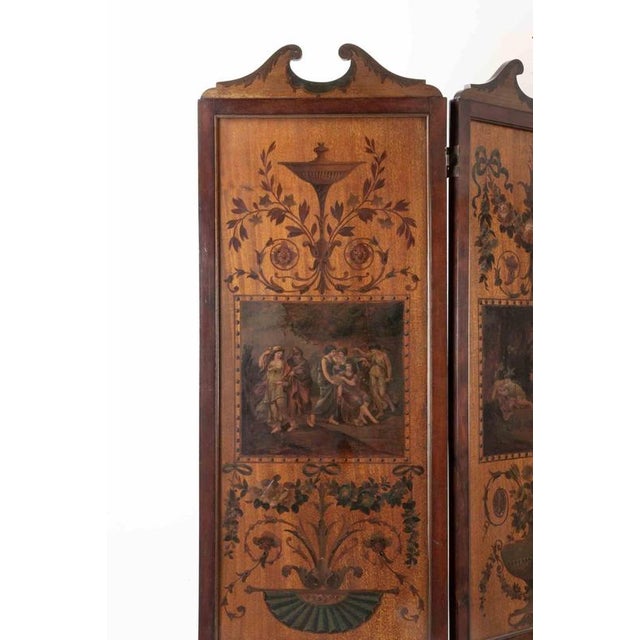 A finely decorated three panels screen with beautiful inlays representing mythological, neoclassical scenes. The folding...