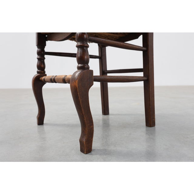 A charming French rustic chair crafted in solid oak, dating from around the turn of the twentieth century. Combining...