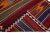 Beautiful kilim handmade wool runner with a red field. This Vintage flatweave rug has orange, purple, and brown accents...