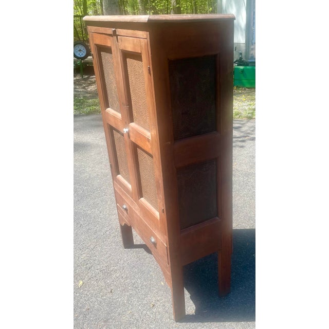Capture a piece of American history with this stunning 19th-century Virginian Punched-Tin Pie Safe. This isn't just a...