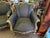 Pair of carved and gilt Rococo chairs, circa 1900. Bergère chairs have been reupholstered with a contemporary fabric....