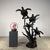 Beautifully hand-cast bronze sculpture featuring four sea turtles swimming upward through a branching coral-like form....