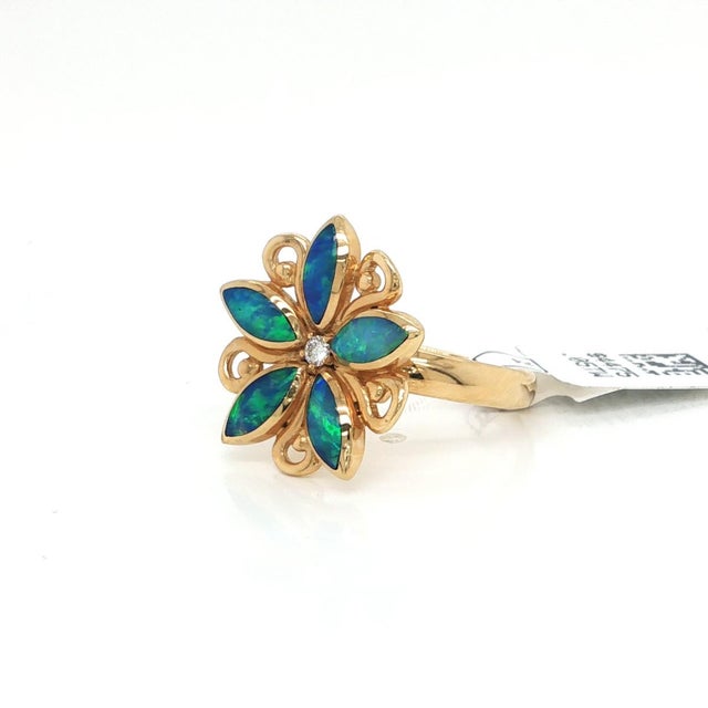 This authentic Kabana Fire Opal & Diamond Flower Ring is a striking piece of fine jewelry, crafted in 14k yellow gold. The...