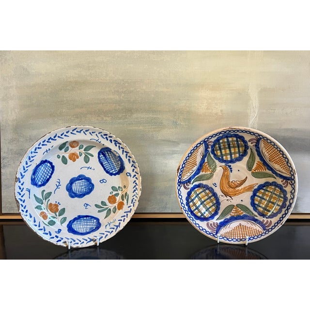 Large Spanish faience plates / shallow bowls, hand painted in the Catalonia region around 1900. This is a set of two.