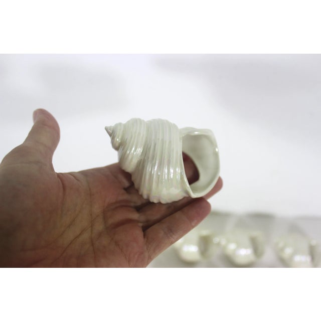 Beautiful set of 11 vintage iridescent ceramic shell napkin rings with a gorgeous shimmer. Excellent vintage condition, no...