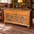 A deeply carved hunting scene gives this oak storage trunk a distinctive country-house presence. Figures, dogs, deer,...
