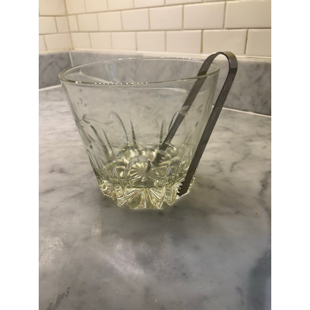 Delicate etched floral design. Tongs serrated. Heavy base. Jazzy cool. Mid century design