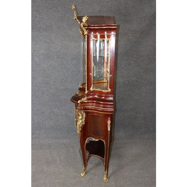 This breathtaking late-19th-century German vitrine, signed by the distinguished cabinetmaker J. Groschkus, represents one...