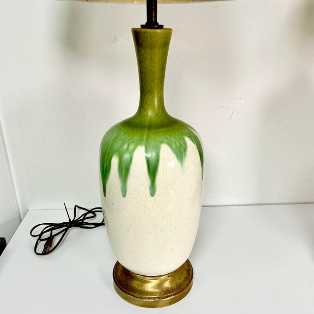 Vintage Home is pleased to offer this pair of green drip ceramic table lamps from the 1950s. Each lamp features multi-...