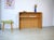 This is a simple console table from WK-Möbel with a light oak veneer. Due to its compact size, it's an ideal piece of...
