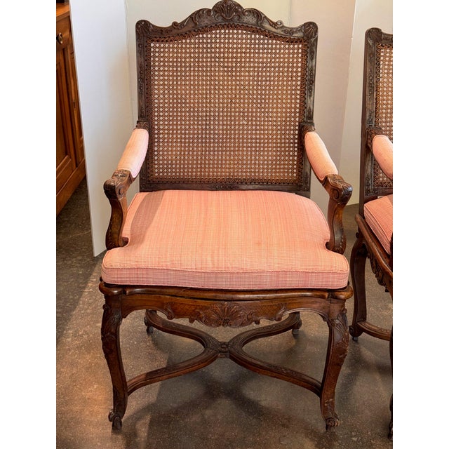 19th Century Pair of Carved French Walnut Armchairs With Caned Backs For Sale - Image 4 of 16