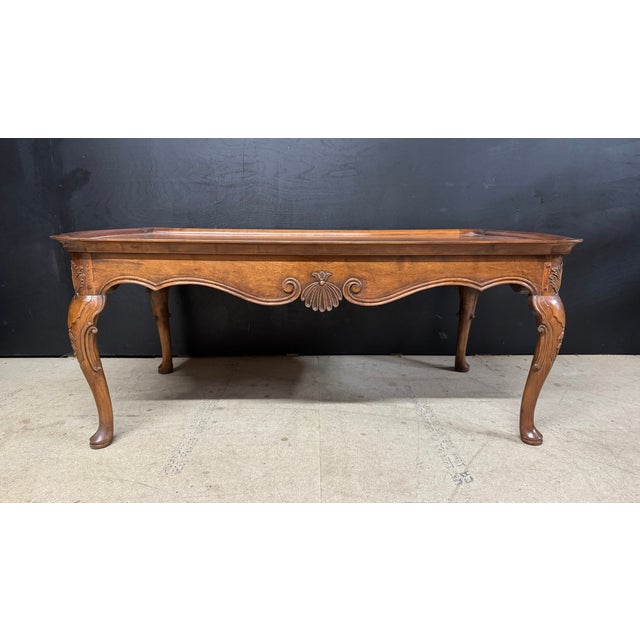 A lovely shaped Burr Walnut Coffee Table, having Queen Anne legs and nicely carved detailing. This example better quality...