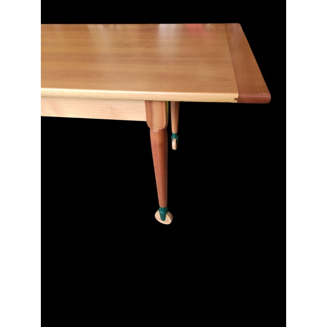 "The Shakers" table by De Padova. Solid cherry table with swivel wheels. This piece is attributed to the mentioned...