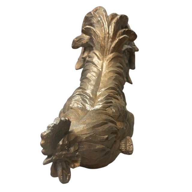 This charming vintage cast iron sculpture captures a proud rooster in a unique, low-profile nesting or crouching stance....