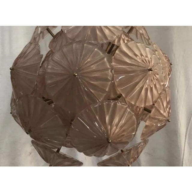 A large number of stylized glass flowers make up this Murano chandelier. An elegant and sophisticated Sputnik classic...