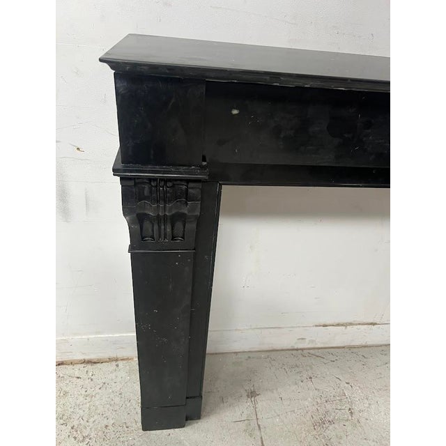 Napoleon iii fireplace in speckled black marble two straight jambs decorated with a corbel featuring recessed fluting good...