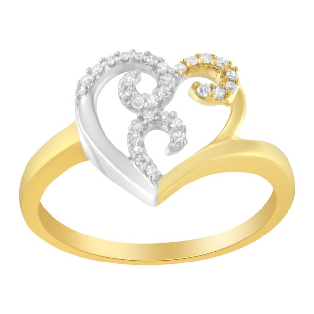 Elegant and classic 10k two toned gold ring. Add femininity to any look with this silver and gold swirly heart that...