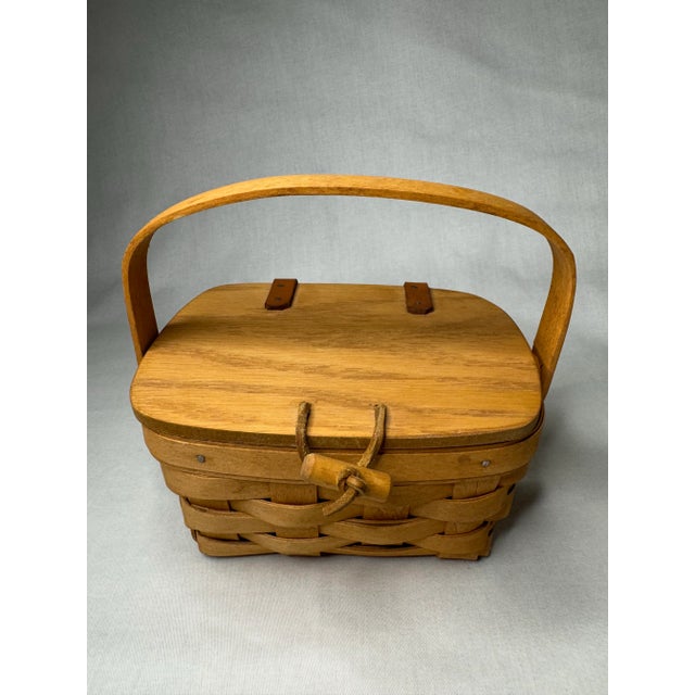 This petite basket is handwoven of bent wood reeds from American basket maker, Longaberger. Along with a solid wood...