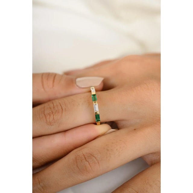 This is part of Chairish’s Fine Jewelry assortment. Alternate Baguette Emerald Diamond Stackable Band Ring in 18K Gold...