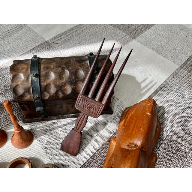 Delicately detailed hair comb, hand carved from a single piece of Ebony wood. Hand carved by Kenyan artisans using...