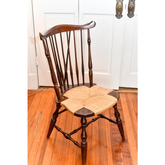 Nice early 20th century Brace Back Windsor side or dining chair with elegant turned legs and stretchers. The seat has...
