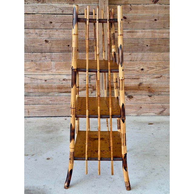 A striking Antique Victorian Aesthetic Movement burnt bamboo étagère featuring four tiers and beautifully scorched...