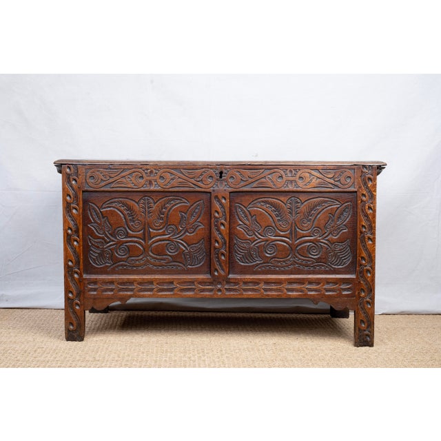A carved oak coffer or blanket chest, c. 1685, English. Constructed with traditional joinery methods. The front features...