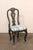 A French provincial pair of black painted side chairs, with hand-painted accents and upholstered seats, from the 19th...