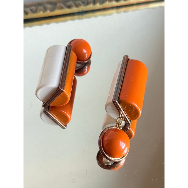 Vintage statement clip on earrings designed in a bold Mod geometric style featuring a color block construction in high...
