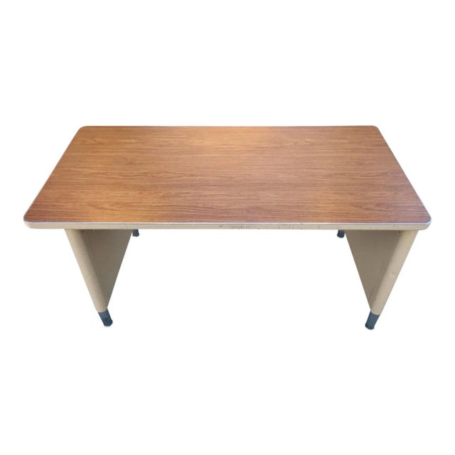 Machine-age industrial work table or desk, featuring dual panel steel leg, hardwood veneer top, with signature chrome self...