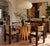 This vintage dining table lets the base do all the talking — dozens of natural bamboo poles, varying in diameter and cut...