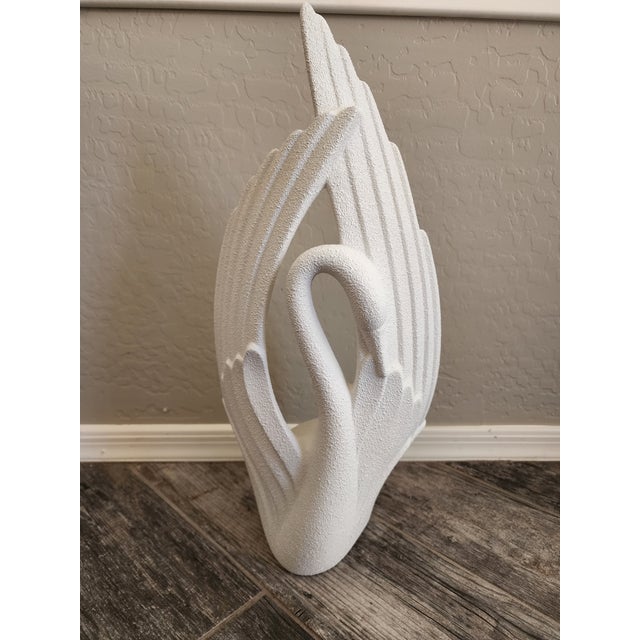A striking 1980s Royal Haeger swan sculpture in the Art Deco Revival style. The swan's graceful curved neck is framed by...